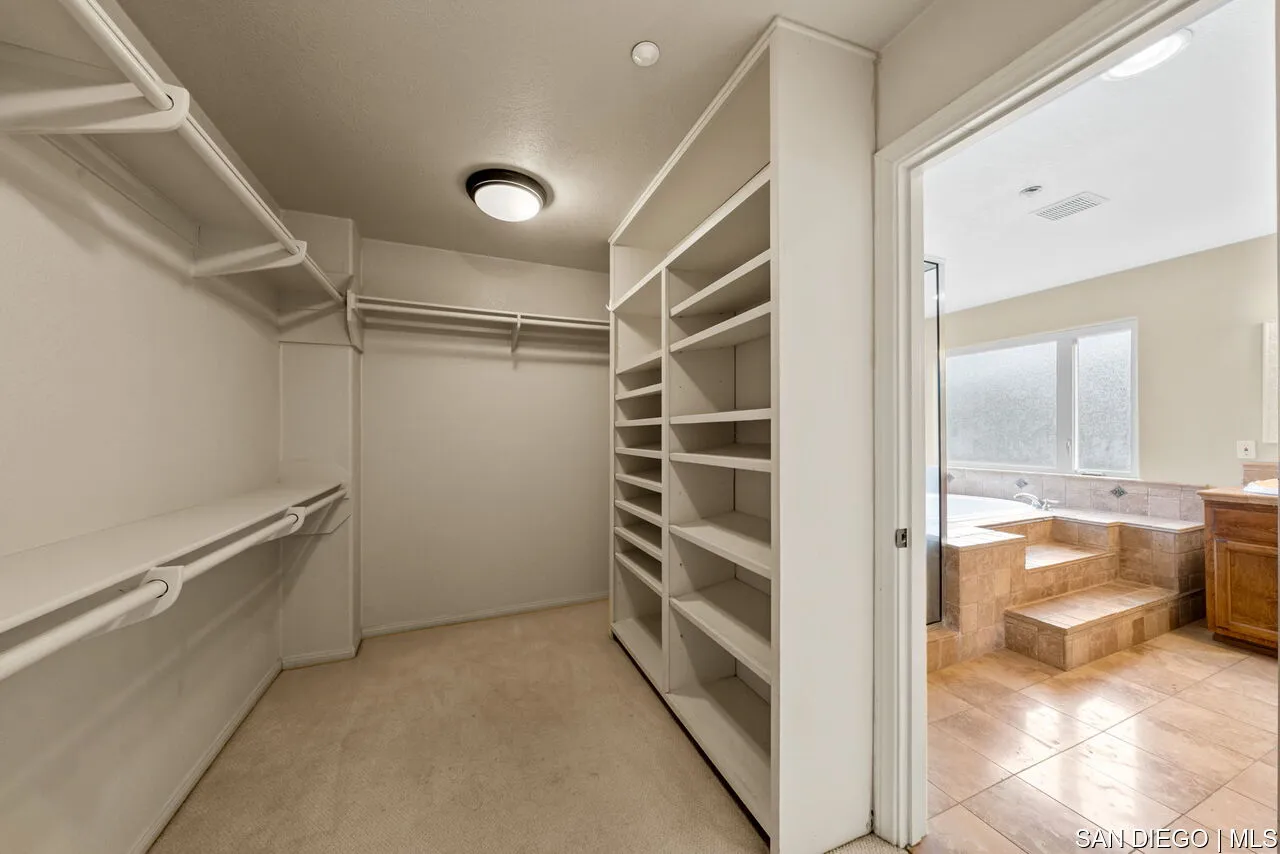9648 Eucalyptus Street Spring Valley, CA 91977 - Photo 31 of 39 a view of walk in closet and bedroom view