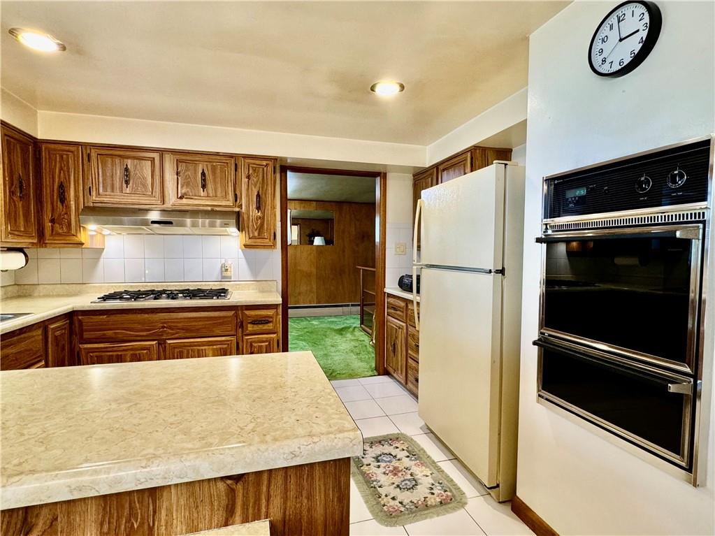 830 Ridge Avenue McKees Rocks, PA 15136 - Photo 15 of 50 Kitchen Showing included Refrigerator, Oven and Gas Cooktop