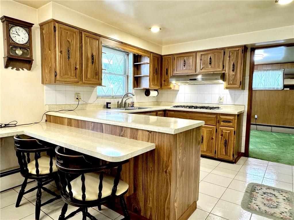 830 Ridge Avenue McKees Rocks, PA 15136 - Photo 16 of 50 countertops in kitchen extend into a breakfast nook with seating for three!