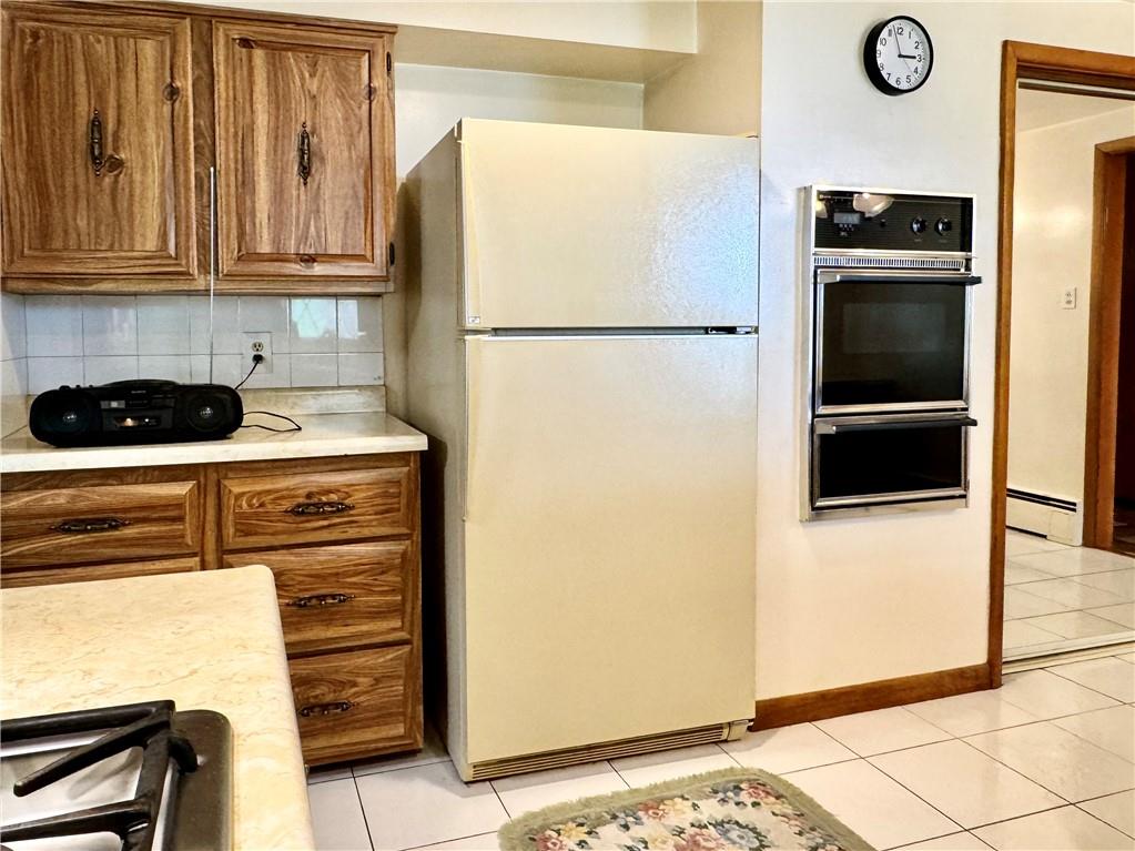 830 Ridge Avenue McKees Rocks, PA 15136 - Photo 20 of 50 Refrigerator and Wall Mounted Gas Stove