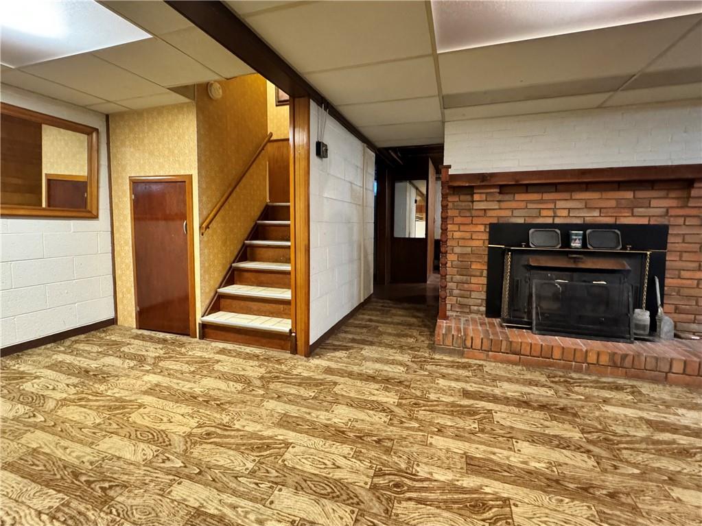 830 Ridge Avenue McKees Rocks, PA 15136 - Photo 38 of 50 Long view showing storage, steps, lower level full bath, and fireplace