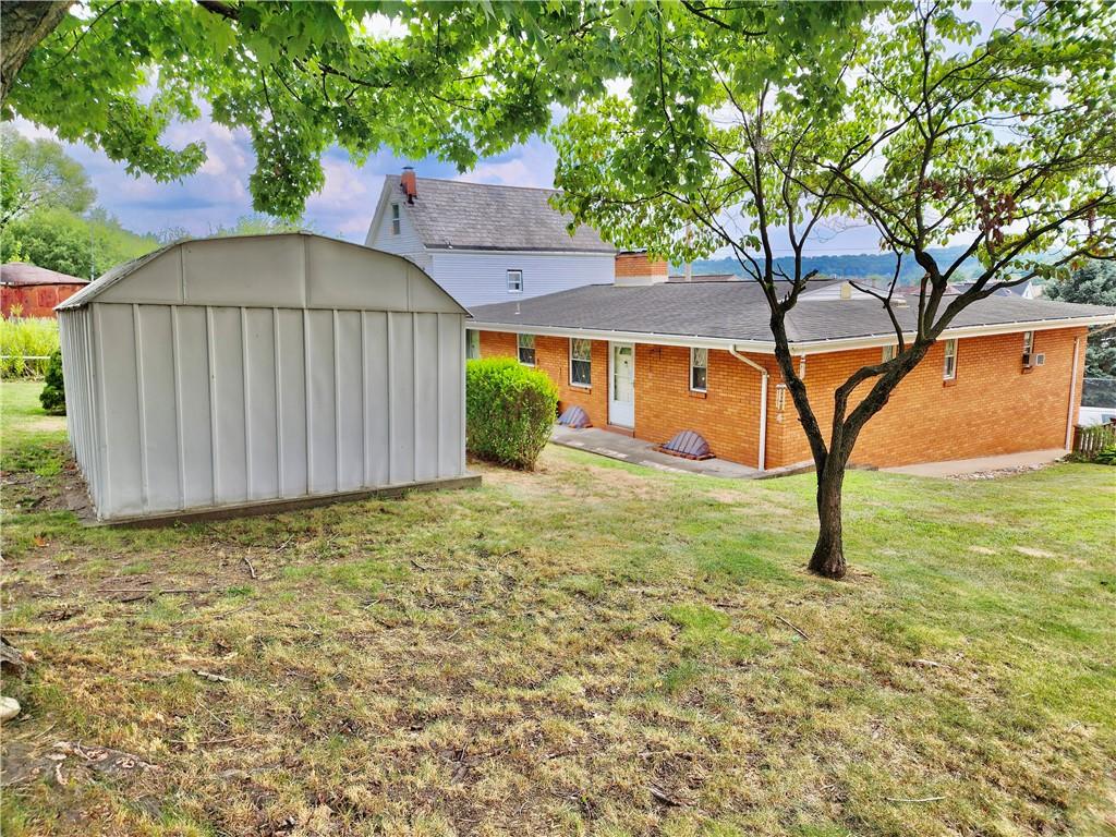 830 Ridge Avenue McKees Rocks, PA 15136 - Photo 47 of 50 Top of yard looking down at storage shed and rear patio