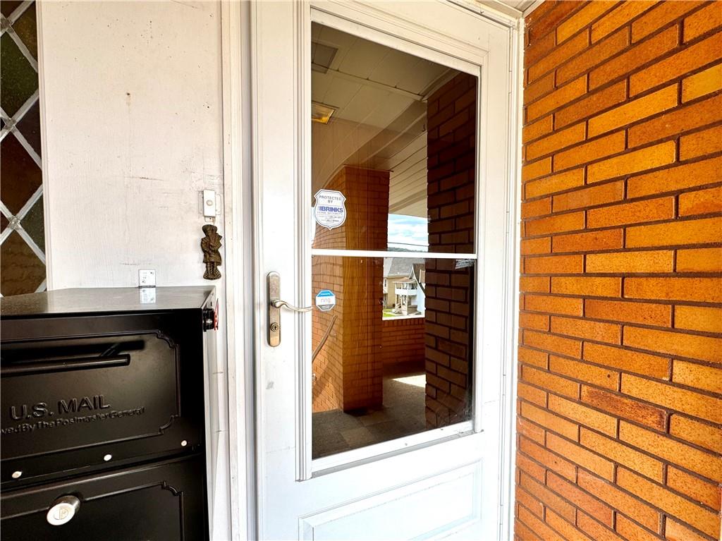 830 Ridge Avenue McKees Rocks, PA 15136 - Photo 6 of 50 Front door with locking screen door and oversized mailbox