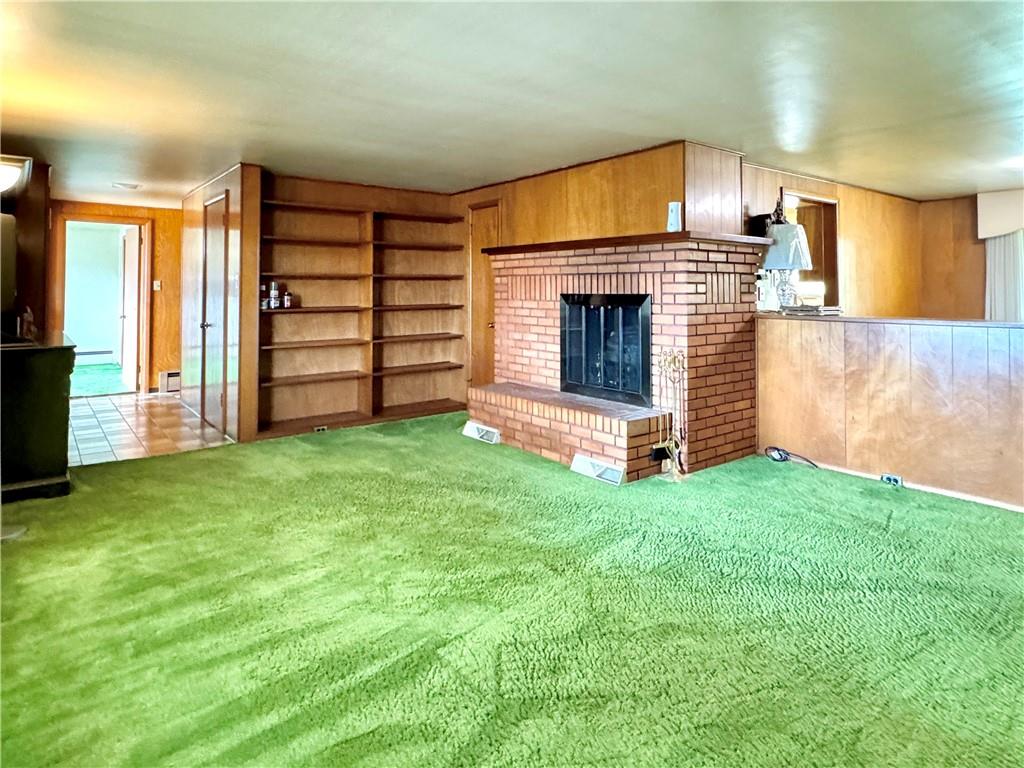 830 Ridge Avenue McKees Rocks, PA 15136 - Photo 8 of 50 Living Room has wood burning fireplace and plenty of bookshelves