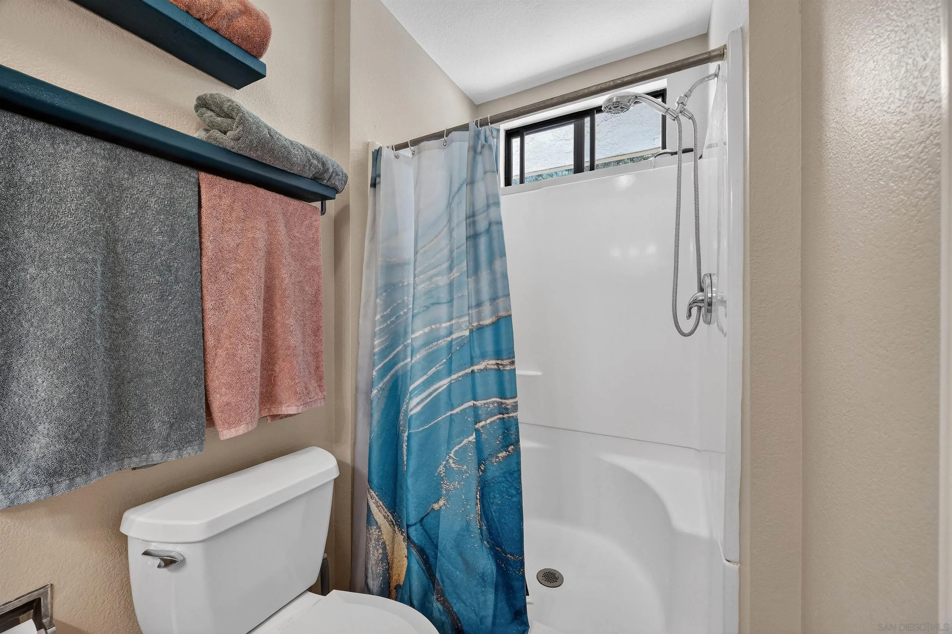 32721 Mountain View Road Bonsall, CA 92003 - Photo 19 of 33 a white toilet sitting next to a shower