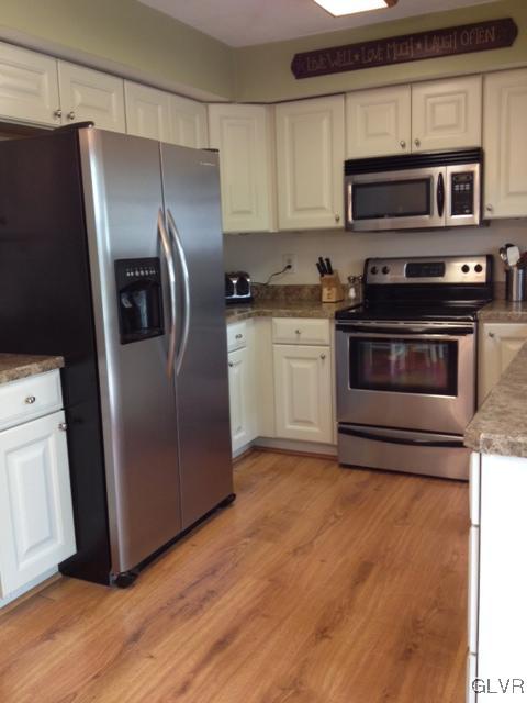 2152 Oak Road Nazareth, PA 18064 - Photo 6 of 11 a kitchen with granite countertop a refrigerator and a stove top oven