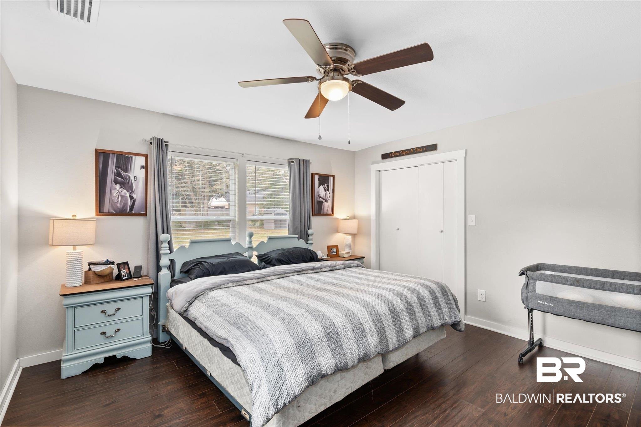 419 Pierce Street Saraland, AL 36571 - Photo 9 of 21 Bedroom featuring dark hardwood / wood-style flooring, a closet, and ceiling fan