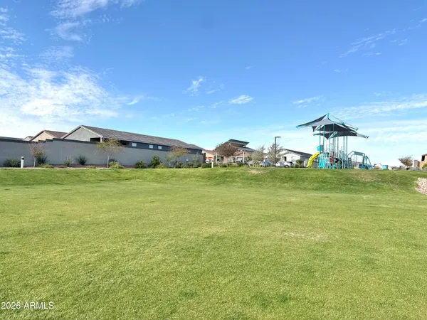 a view of a pathway with a big yard