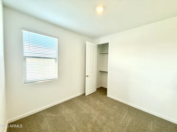 a kitchen with stainless steel appliances granite countertop a sink a stove and a wooden floor