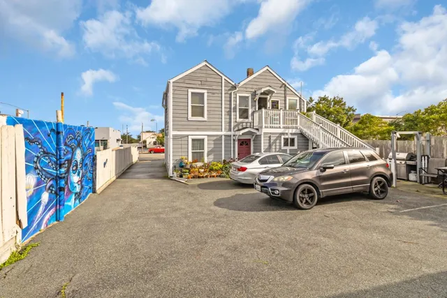 a view of a car parked in front of a house