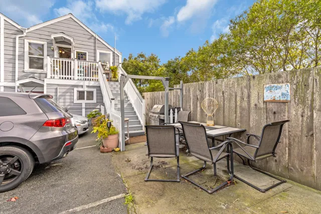 a view of a car parked in front of a house