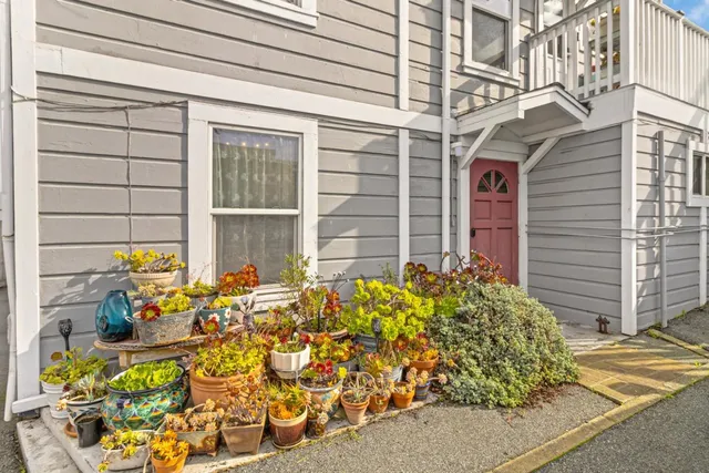 a living room with furniture and a bookshelf