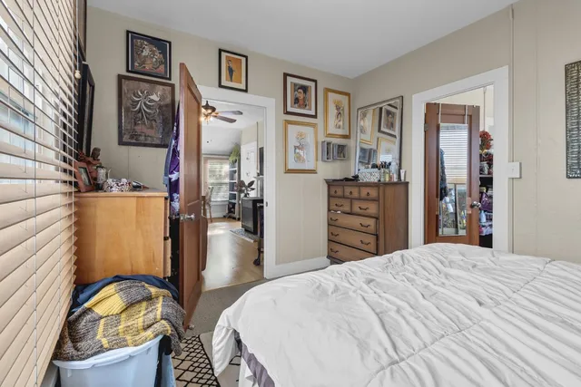 a view of a livingroom with furniture and a window