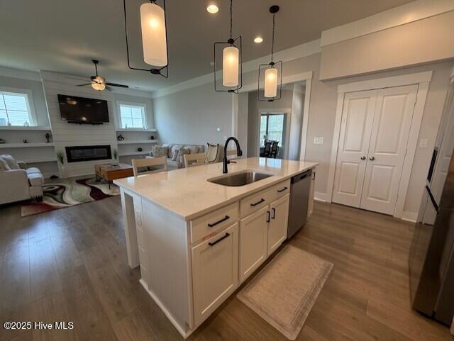 203 Farmstead Loop Moyock, NC 27958 - Photo 18 of 75 OPEN KITCHEN WITH QUARTZ COUNTER TOPS, SOFT CLOSE CABINETRY, GAS RANGE, MICROWAVE, DISHWASHER AND 2ND WALL OVEN, OVER/UNDER CABINTRY LIGHTING, DEEP SINK IN ISLAND, THIS IS THE CENTRAL POINT OF THE DOWNSTAIRS AREA.