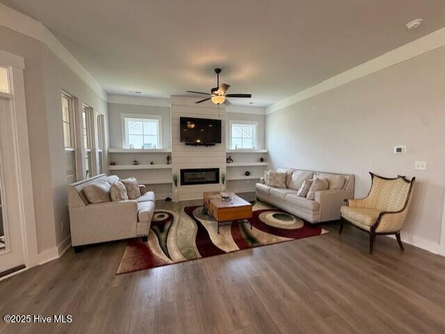 203 Farmstead Loop Moyock, NC 27958 - Photo 28 of 75 GREAT ROOM WITH BUILT IN FLOATING SHELVING ON BOTH SIDES OF THE 48" LINEAR FIREPLACE.