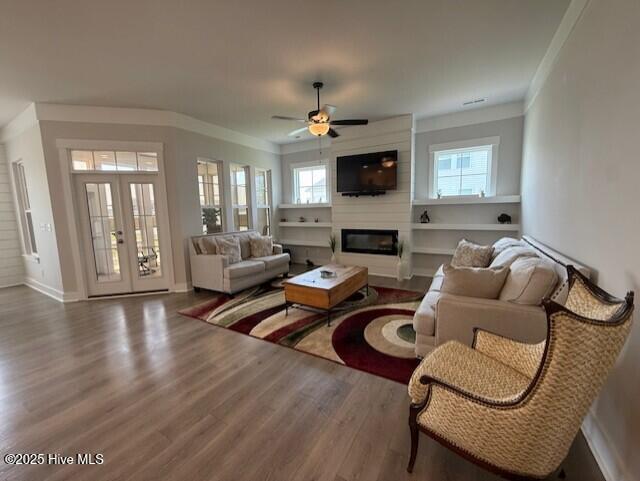203 Farmstead Loop Moyock, NC 27958 - Photo 29 of 75 GREAT ROOM WITH BUILT IN FLOATING SHELVING ON BOTH SIDES OF THE 48" LINEAR FIREPLACE.