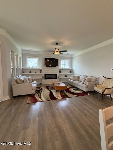 203 Farmstead Loop Moyock, NC 27958 - Photo 30 of 75 GREAT ROOM WITH BUILT IN FLOATING SHELVING ON BOTH SIDES OF THE 48" LINEAR FIREPLACE.