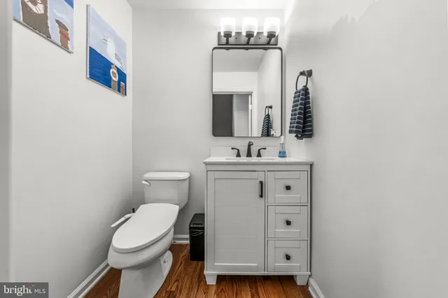 a bathroom with a sink toilet tub and shower