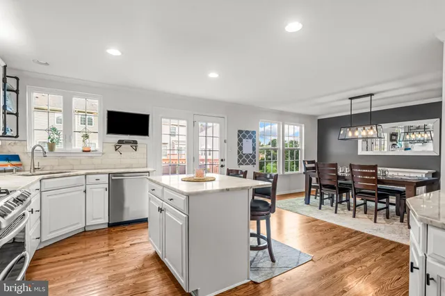 a kitchen with a sink stove and microwave