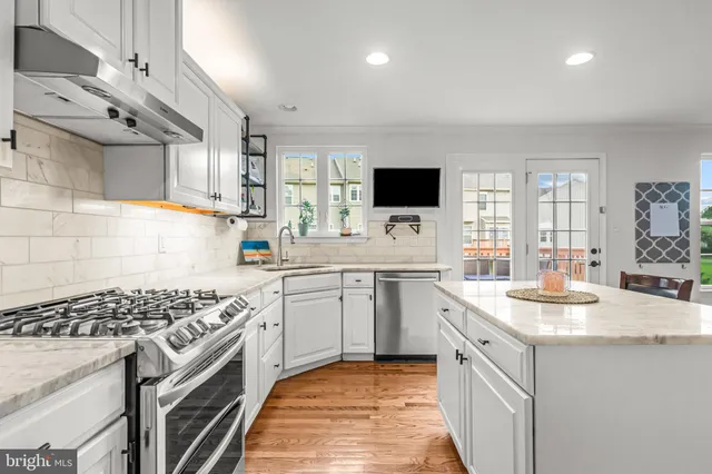 a kitchen with a table and chairs in it