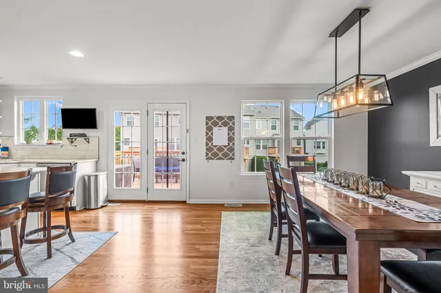 a kitchen with granite countertop a refrigerator and a sink