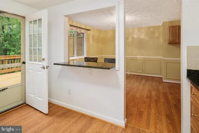 a view of a kitchen from the hallway