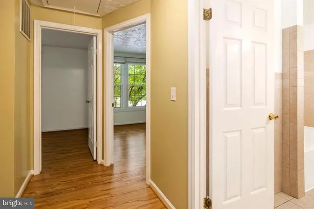 a view of a bathroom with a toilet and a shower