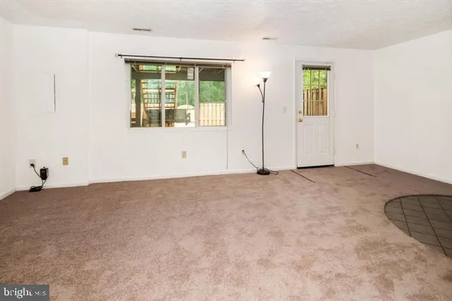 an entryway with wooden floor and stairs