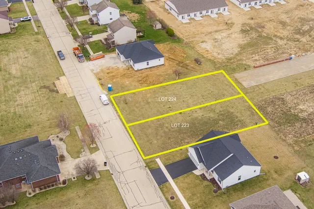 an aerial view of house with pool