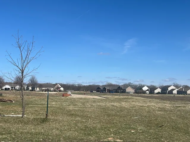 a view of a lake with houses in the back