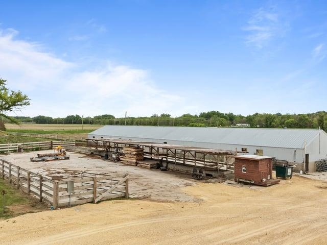 8294 North Leaf River Road Leaf River, IL 61047 - Photo 43 of 56 a view of a lake with houses in the background