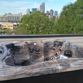 a large kitchen with cabinets wooden floor and stainless steel appliances