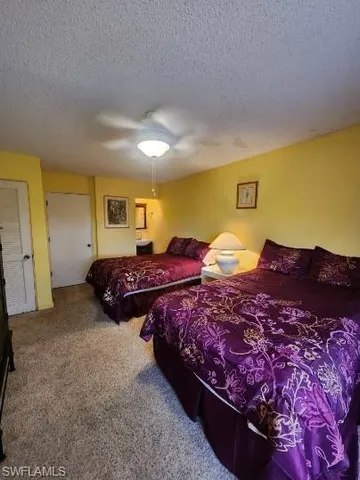 a spacious bedroom with bed and window