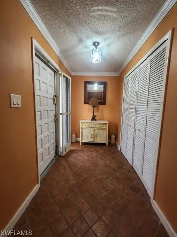 a view of a hallway with front door