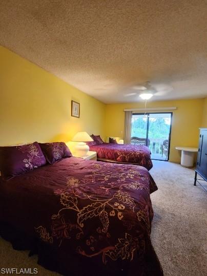 925 Palm View Drive, Unit F120 Naples, FL 34110 - Photo 10 of 22 a large bed sitting in a bedroom next to a window