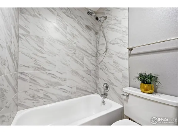 a bathroom with a bathtub and sink