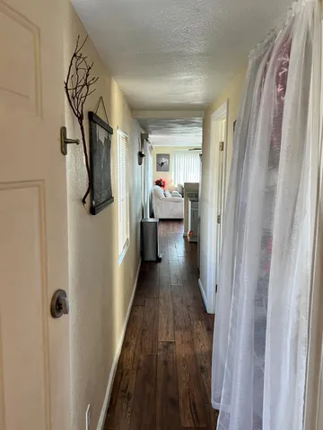 a view of a hallway with a couch