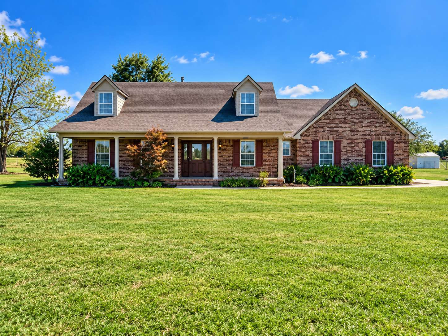 21800 East 450th Road Claremore, OK 74019 - Photo 1 of 23 Brick exterior with an inviting covered porch, supported by four columns
