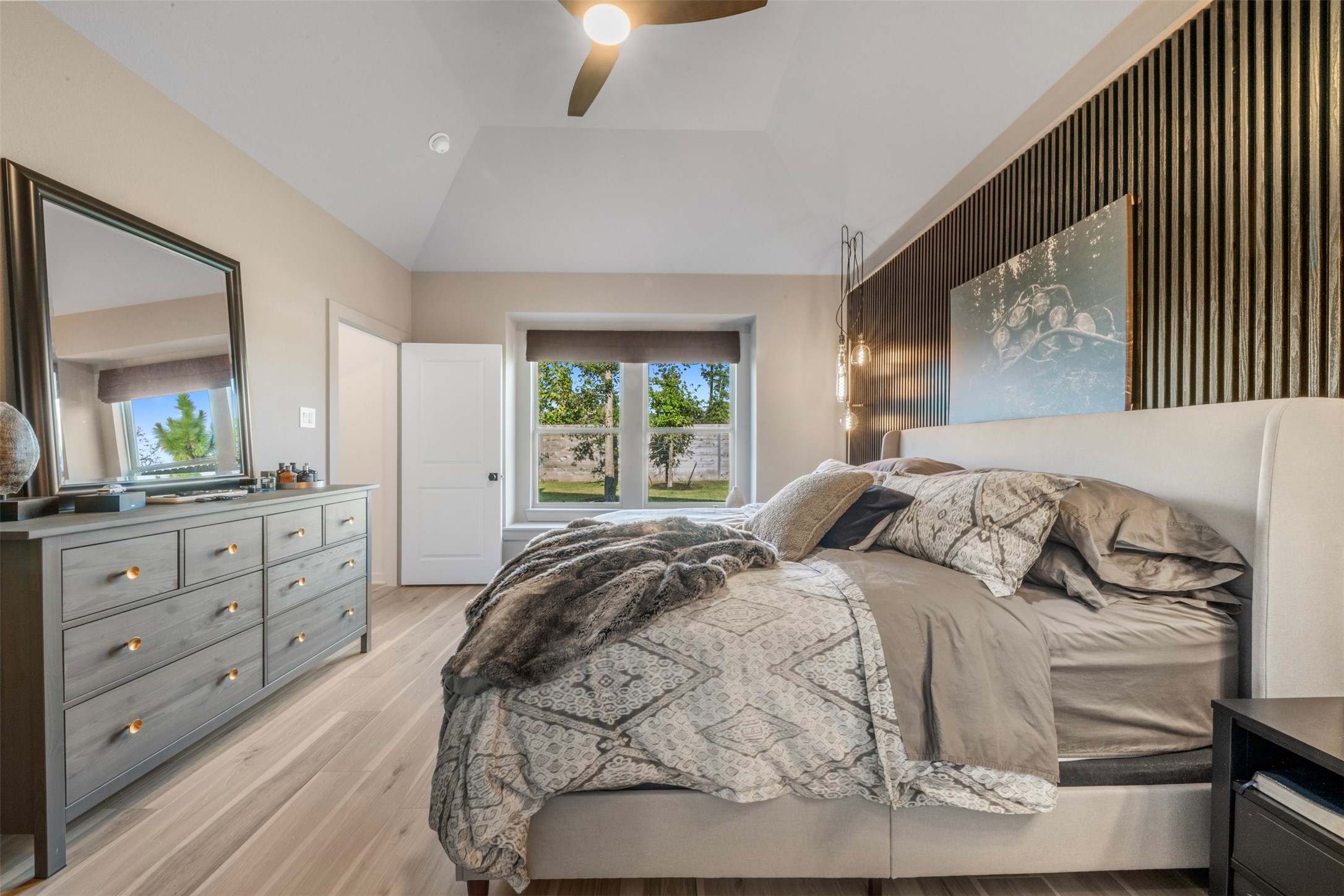 15650 Turtlehead Trail Conroe, TX 77302 - Photo 15 of 37 a bedroom with a bed and a dresser