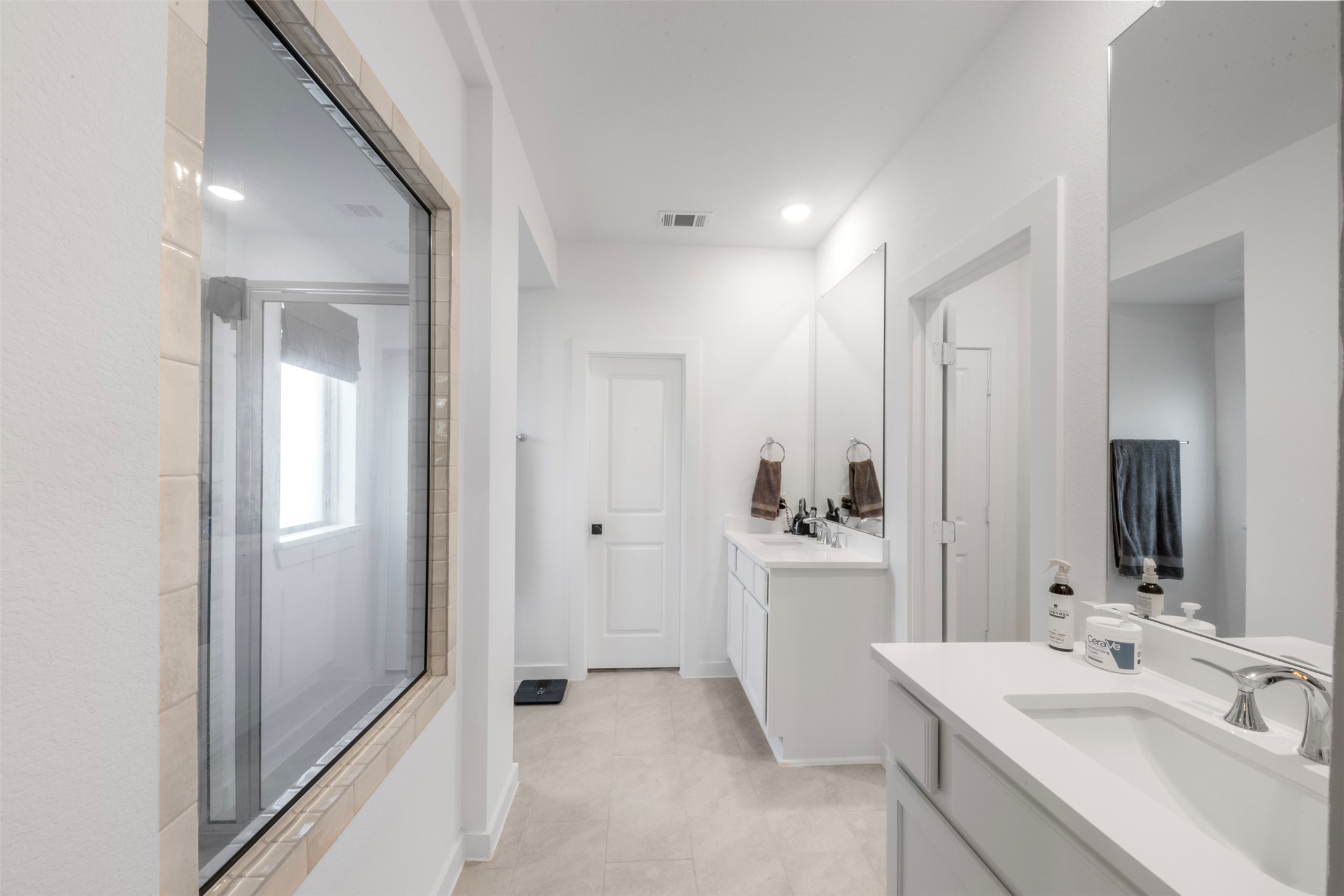 15650 Turtlehead Trail Conroe, TX 77302 - Photo 16 of 37 a bathroom with a sink and a mirror