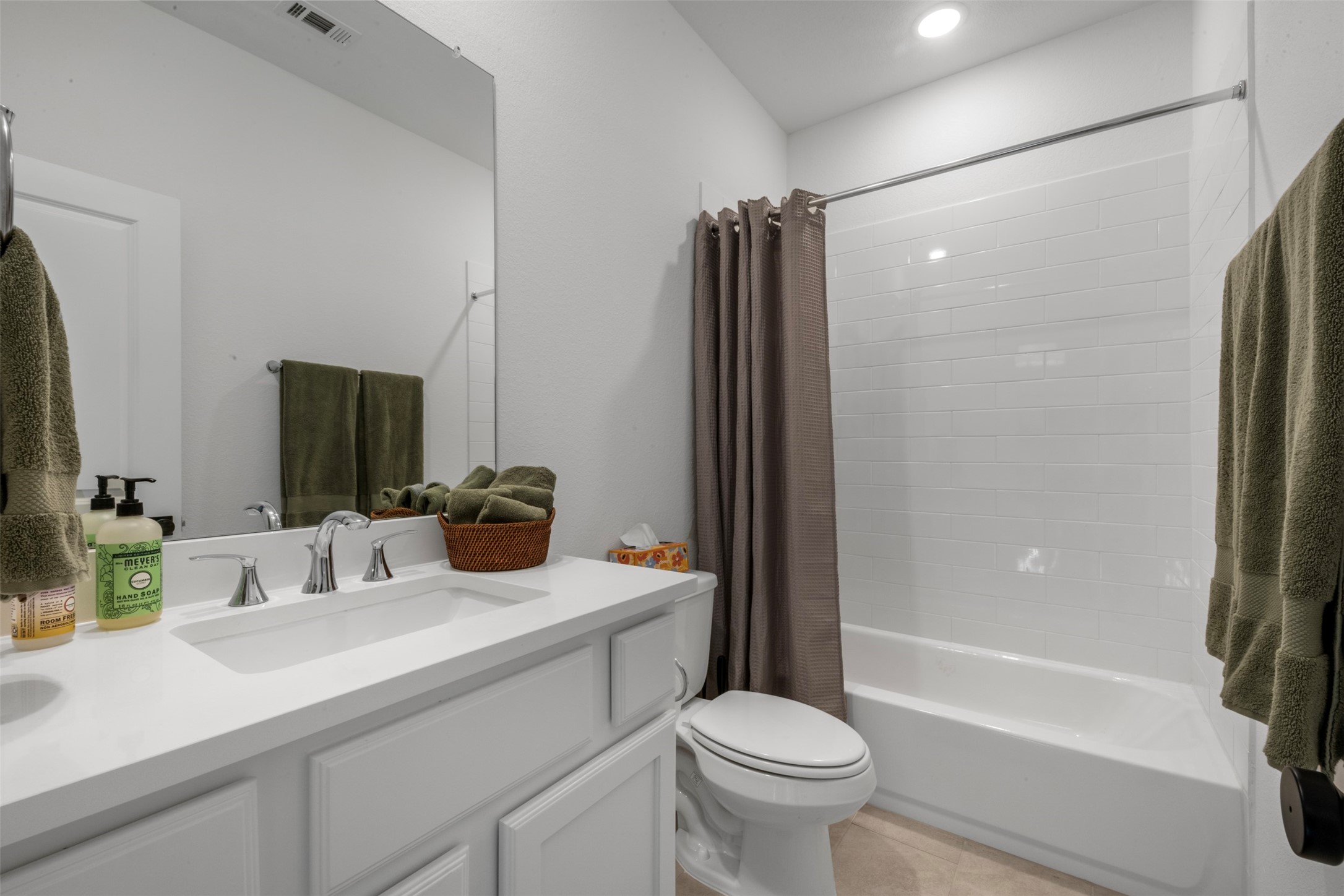 15650 Turtlehead Trail Conroe, TX 77302 - Photo 19 of 37 a bathroom with a shower sink vanity mirror and toilet