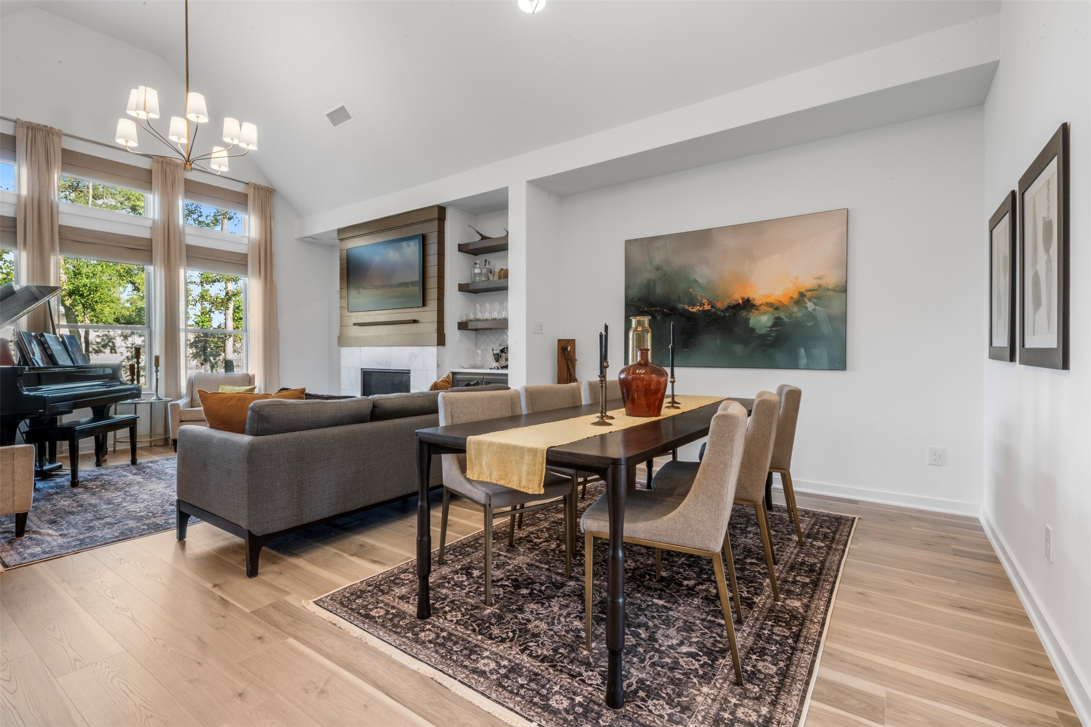 15650 Turtlehead Trail Conroe, TX 77302 - Photo 4 of 37 a living room with furniture a chandelier and a flat screen tv