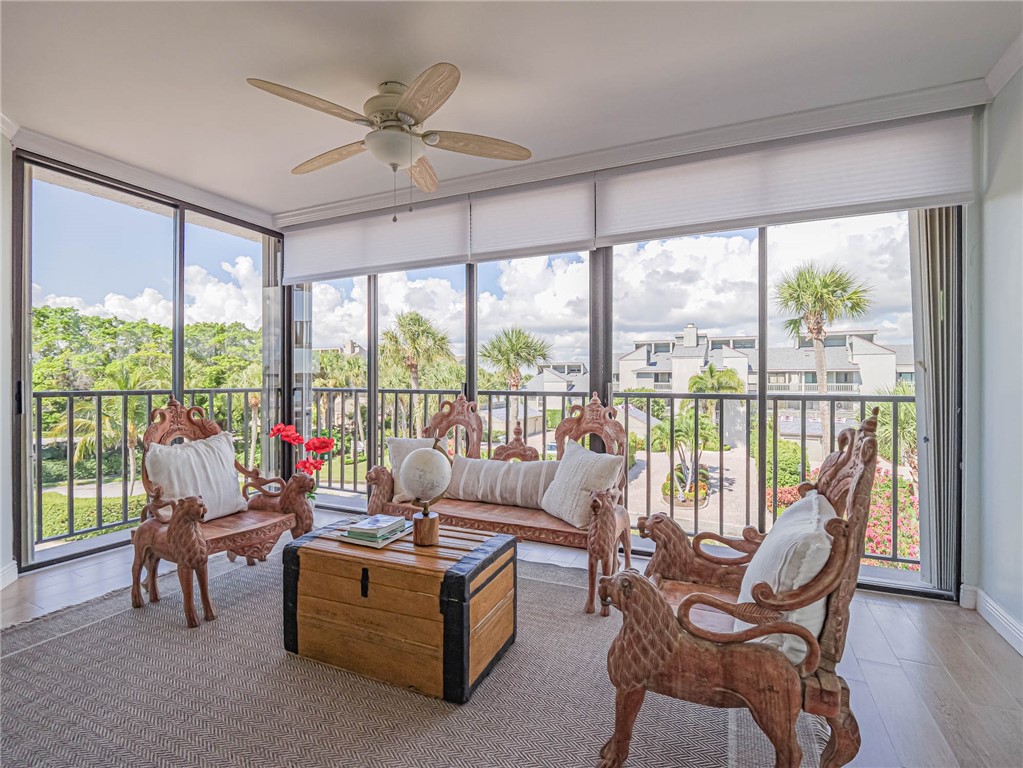 1850 Bay Road, Unit 3G Vero Beach, FL 32963 - Photo 28 of 36 a living room with furniture and a large window with garden view