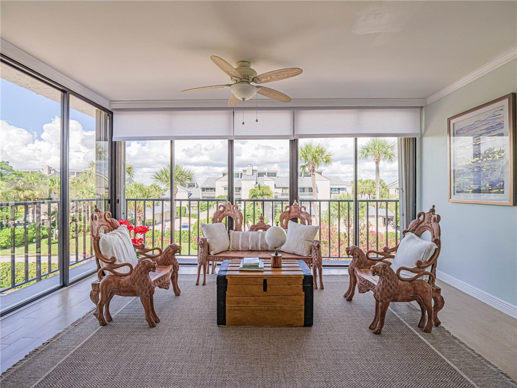 1850 Bay Road, Unit 3G Vero Beach, FL 32963 - Photo 30 of 36 a living room with furniture and floor to ceiling windows