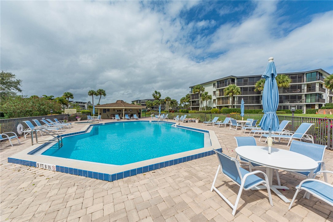 1850 Bay Road, Unit 3G Vero Beach, FL 32963 - Photo 35 of 36 a view of a swimming pool with outdoor seating space