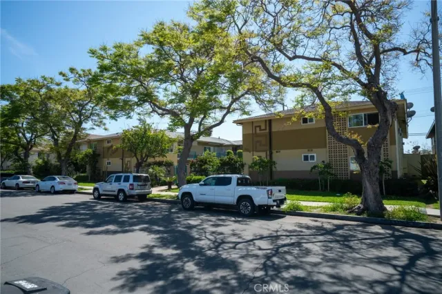 a view of car parked on the side of a road