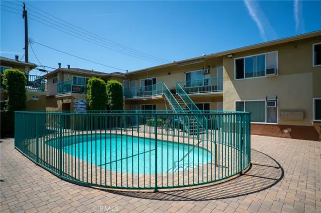 a view of a house with a small deck