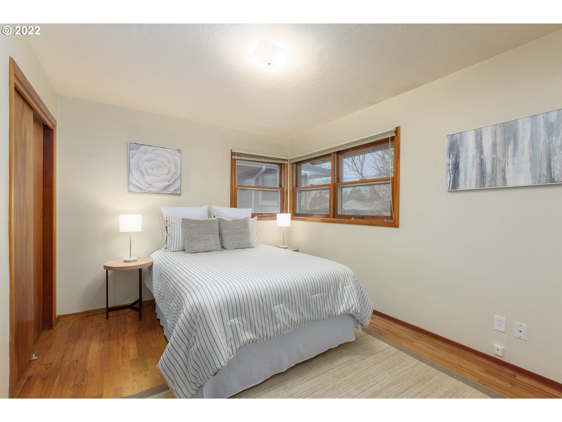 12015 Northeast Morris Street Portland, OR 97220 - Photo 14 of 23 a bedroom with a bed and window