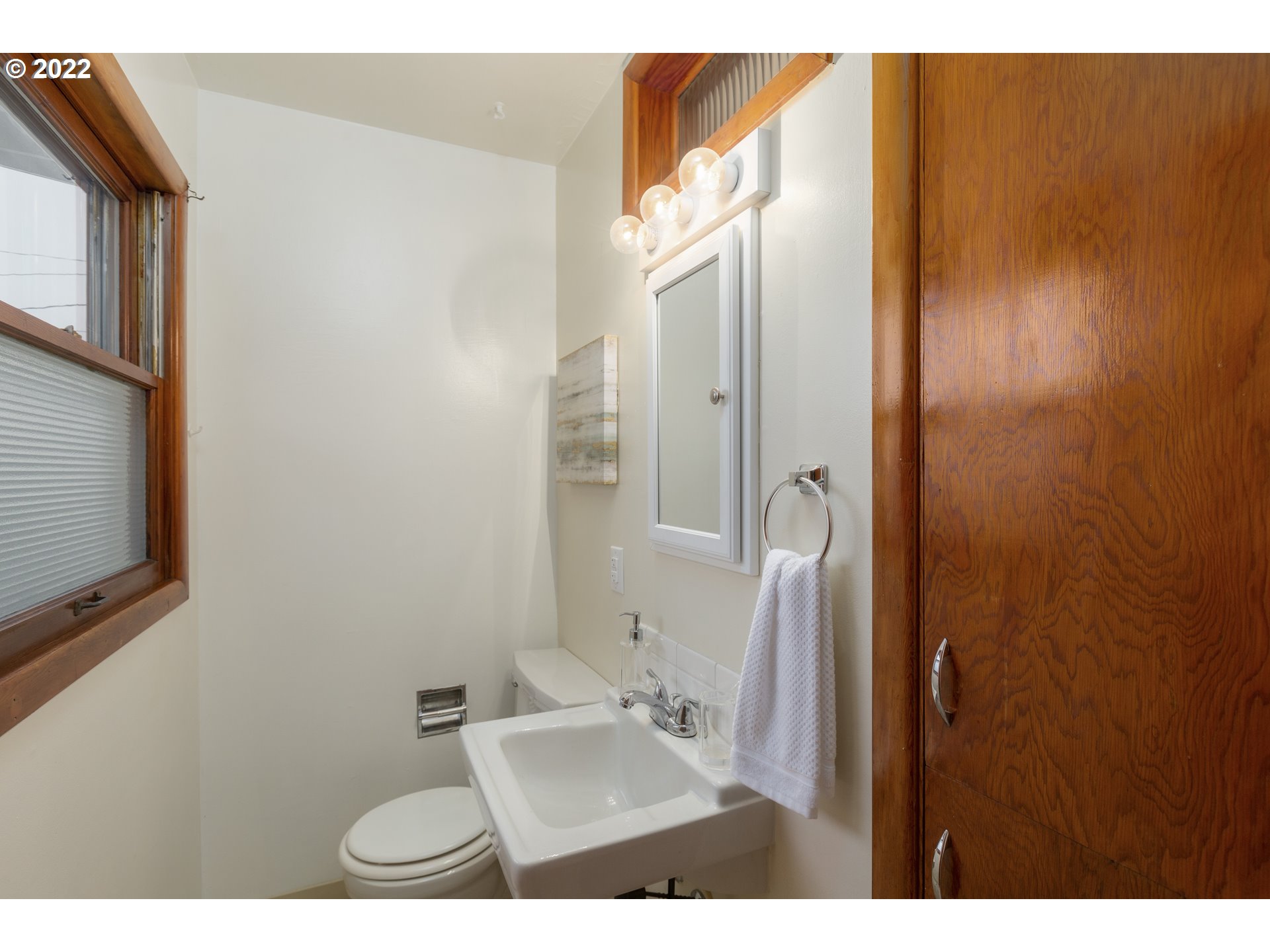 12015 Northeast Morris Street Portland, OR 97220 - Photo 16 of 23 a bathroom with a sink and mirror