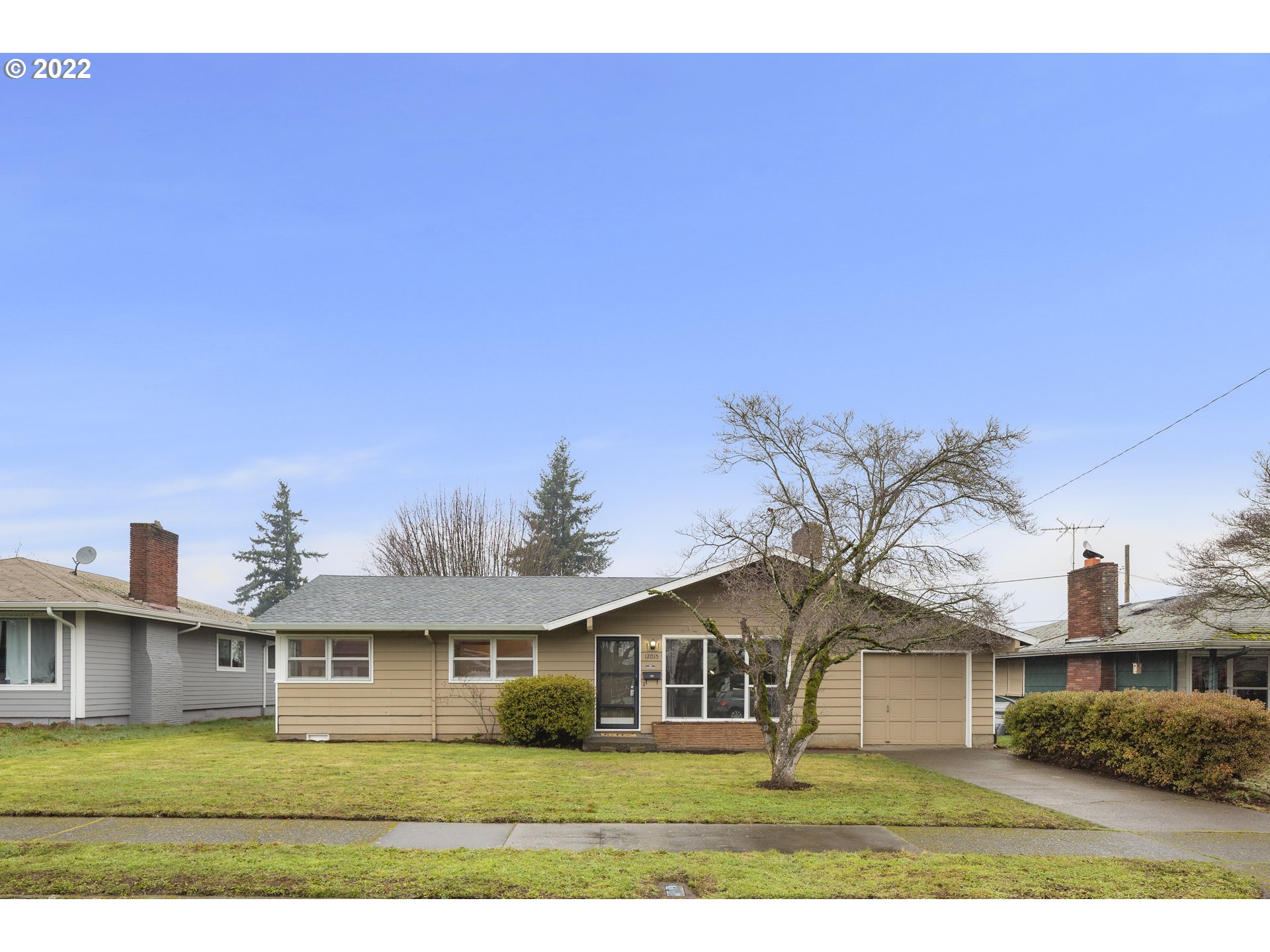 12015 Northeast Morris Street Portland, OR 97220 - Photo 23 of 23 a front view of residential houses with yard